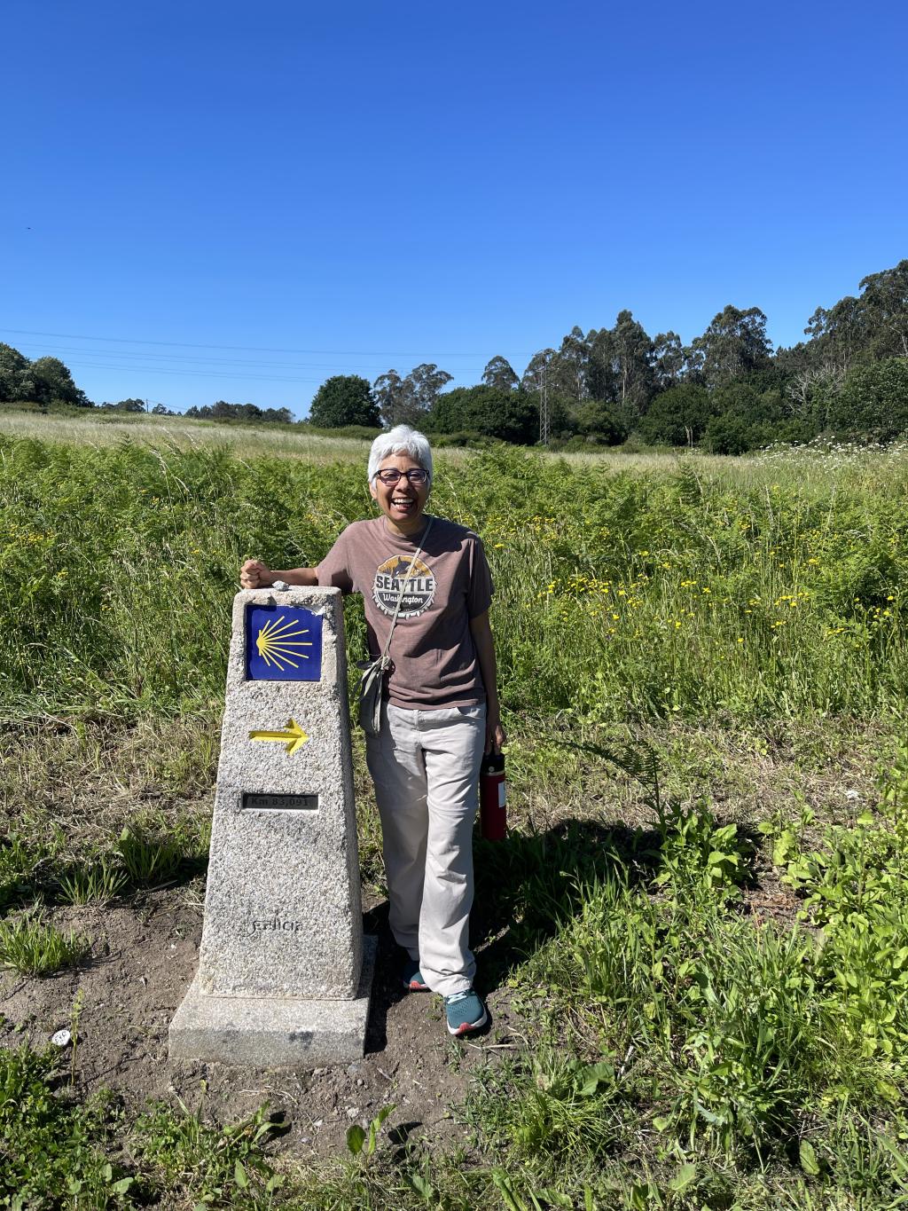 Laura Pulido stands next to a historical marker.